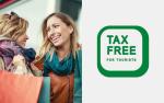 2 uśmiechnięte kobiety, a obok zielony napis Tax free four tourists